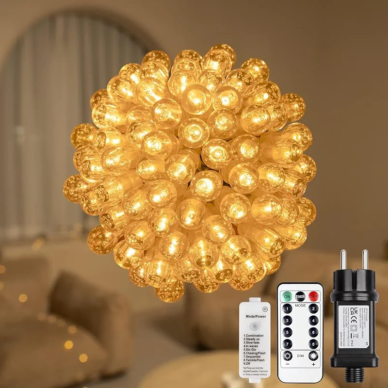 Besuche den Koopower-Store Koopower 100er LED Lichterkette mit Timer Innen 31V, 10M Transparenter Draht + 1, 5M Kabel, Warmweiß (8 Modi gesteuert durch Taste und Fernbedienung) — Weihnachtsbeleuchtung