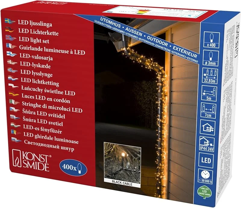 Besuche den Konstsmide-Store Konstsmide Micro LED Lichterkette, 400 bernsteinfarbene Dioden, 24V Außentrafo, schwarzes Kabel - 3644-800 — Weihnachtsbeleuchtung