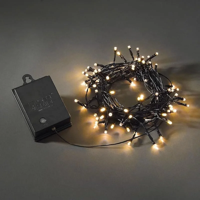 Besuche den Konstsmide-Store Konstsmide LED Lichterkette, mit an, aus Schalter, Lichtsensor, 6h und 9h Timer, 80 bernsteinfarbene Dioden, batteriebetrieben, Außen (IP44), schwarzes Kabel, schwarze Box - 3728-800 — Weihnachtsbeleuchtung